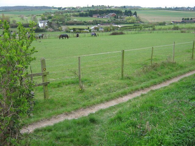 Footpath to Clement Street The track in front is a bridlepath. The footpath leads through several horse paddocks (and several stiles) in the valley.