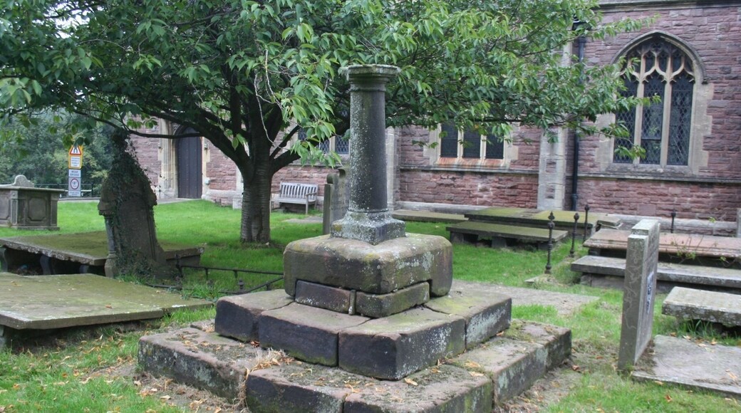 Grade II listed medieval cross base with later sundial. This is a photo of listed building number 1017839.