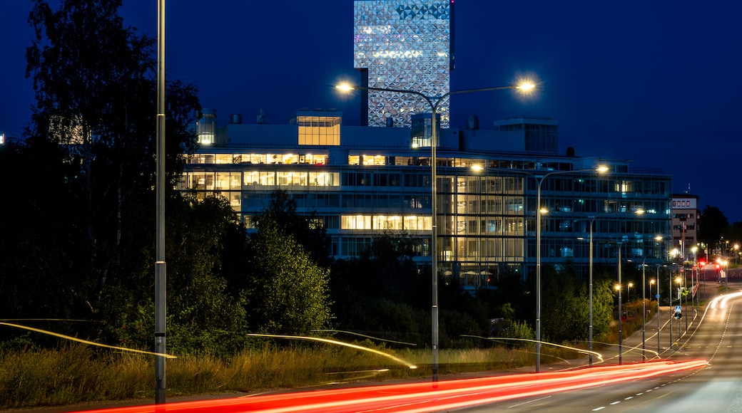 Stockholm, Sweden A night view of the Victoria Tower in the Kista suburb and red traffic streaks.