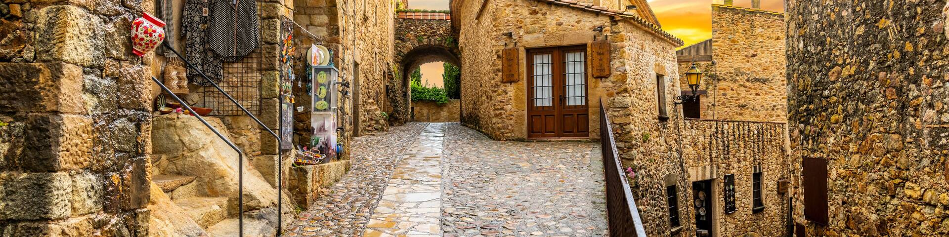 The medieval Spanish village of Pals in the Costa Brava region of Southern Spain as the sun sets after a summer rainstorm.