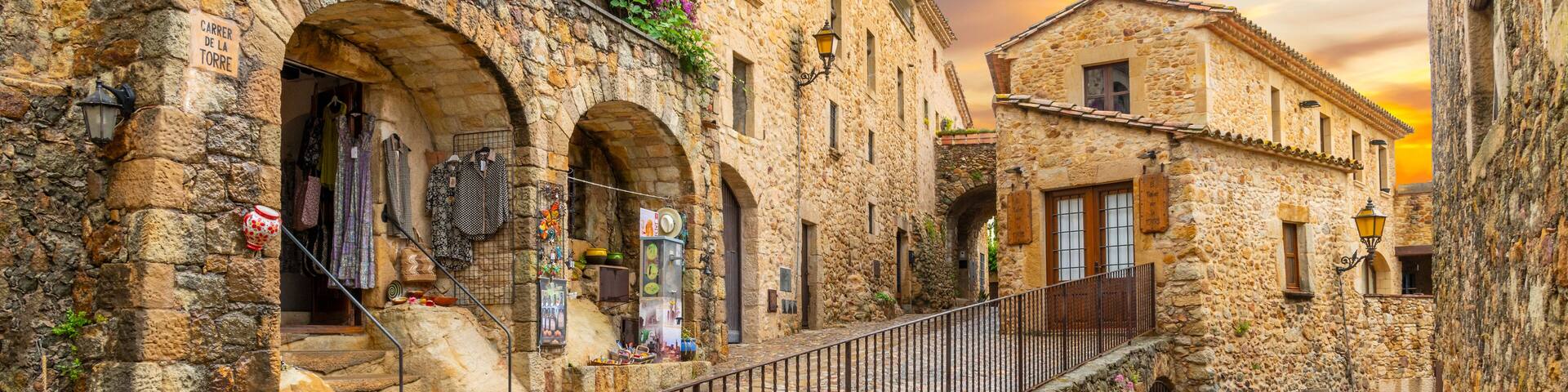 The medieval Spanish village of Pals in the Costa Brava region of Southern Spain as the sun sets after a summer rainstorm.