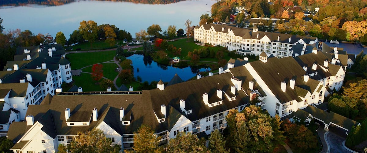 Aerial vista at sunrise over Elkhart Lake, The Osthoff Resort's reflecting pond during colorful autumn, Elkhart Lake, Wisconsin, USA.
