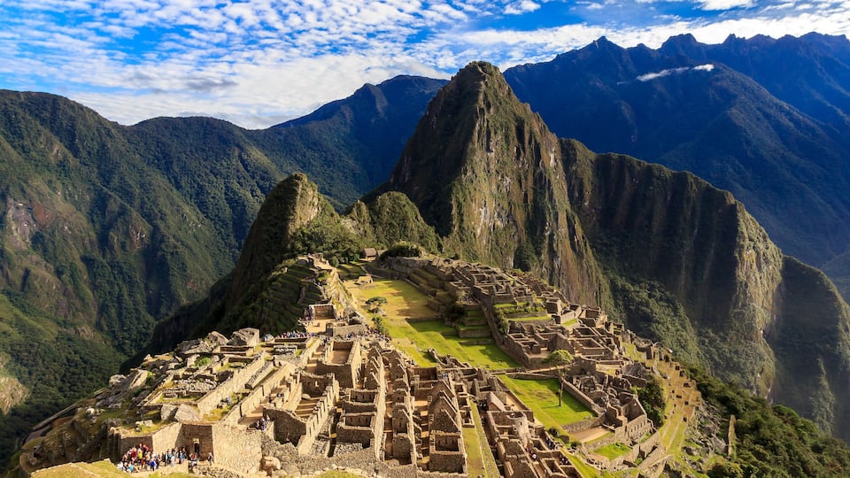 Machu Picchu, an ancient Incan city with terraced ruins and steep mountain backdrops.