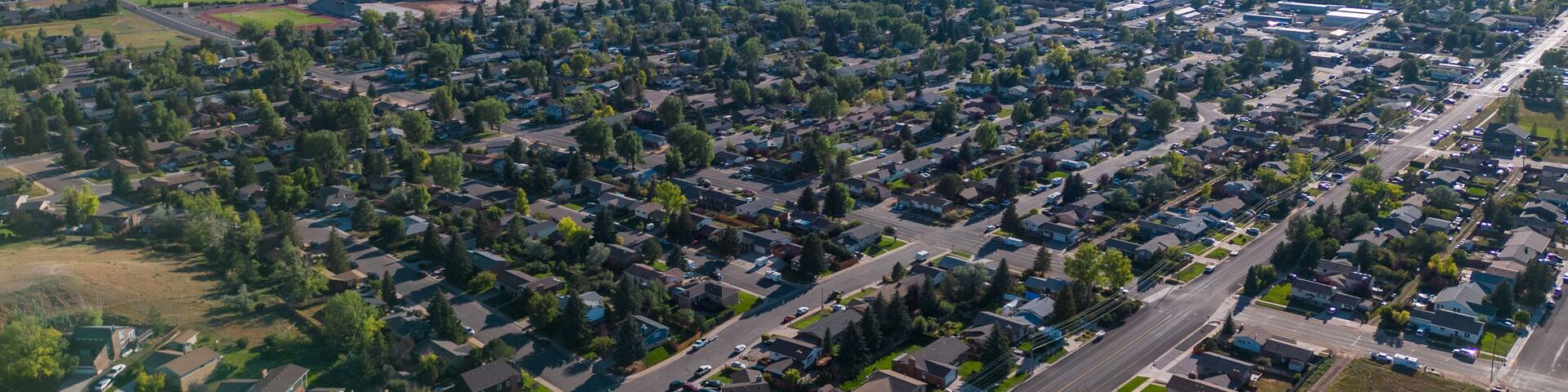 Neighborhood aerial drone picture of cityscape and town with houses and homes from air from aerial drone