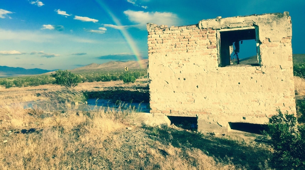 Some ruins on Historic Route 66, proceeding a desert rain storm. Notice the rainbow.
