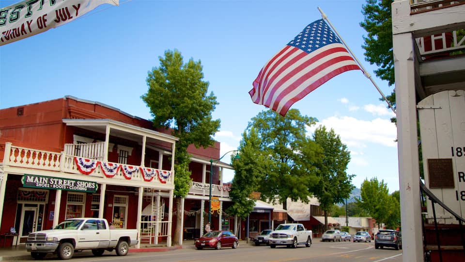 Main Street Shoes store, a white pickup truck, and a large American flag.