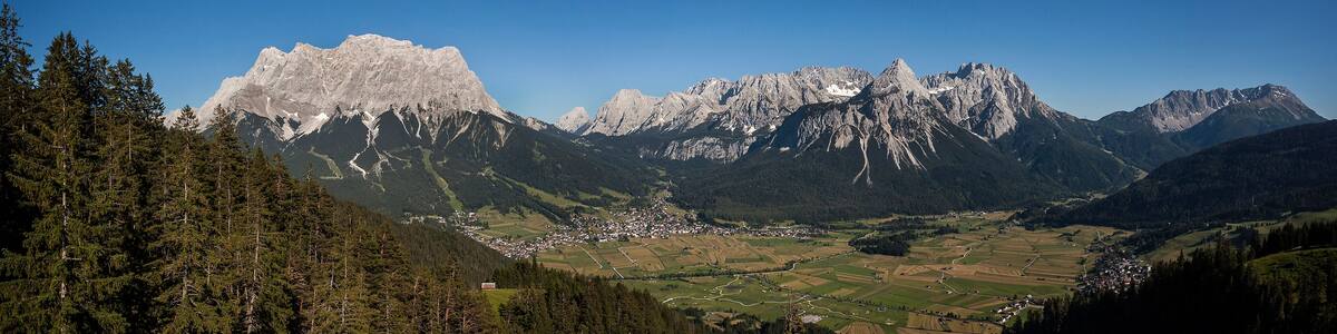 Panorama of mountains Zugspitze and Ehrwalder Sonnenspitz in Tyrol, Austria