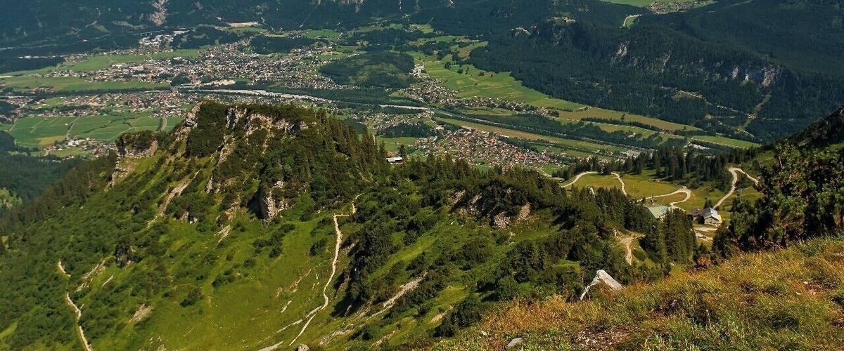 July 2015
Town Reutte, Tyrolia, Austria
Reutte is a market town in the Austrian state of Tyrolia. Reutte is located in the altitude of 853 meters on the Lech river, and has a population of 6,210.
The name "Reutte" has its origin in "roden" or "reuten" meaning glade.
Reutte is a popular holiday resort and its proximity to the famous Bavarian Castles of Neuschwanstein, Schwangau or the Ehrenberg ruins make Reutte a cultural destination as well as a skiing destination.
View from Hahnenkamm in Tannheimer Berge. In the background you can see Zugspitze and Wetterstein mountain ranges.