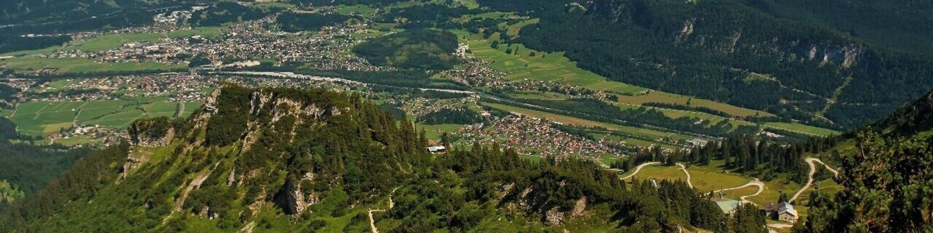 July 2015
Town Reutte, Tyrolia, Austria
Reutte is a market town in the Austrian state of Tyrolia. Reutte is located in the altitude of 853 meters on the Lech river, and has a population of 6,210.
The name "Reutte" has its origin in "roden" or "reuten" meaning glade.
Reutte is a popular holiday resort and its proximity to the famous Bavarian Castles of Neuschwanstein, Schwangau or the Ehrenberg ruins make Reutte a cultural destination as well as a skiing destination.
View from Hahnenkamm in Tannheimer Berge. In the background you can see Zugspitze and Wetterstein mountain ranges.