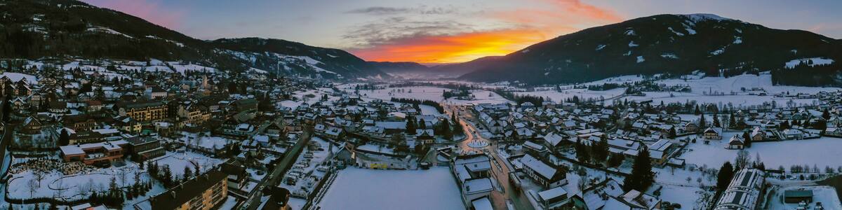 Panoramic view on Sankt Michael im Lungau at sunrise, Austria - January 2020. Aerial drone view.