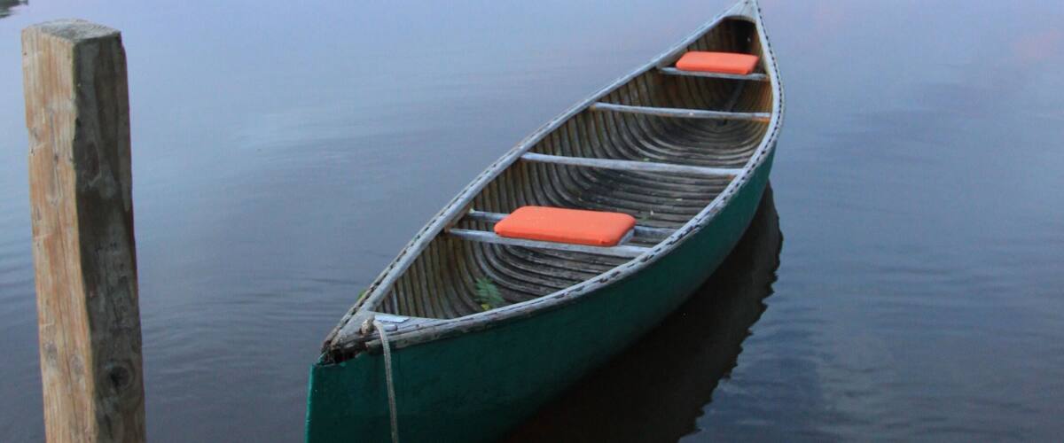 canoe on river at sunrise, canada