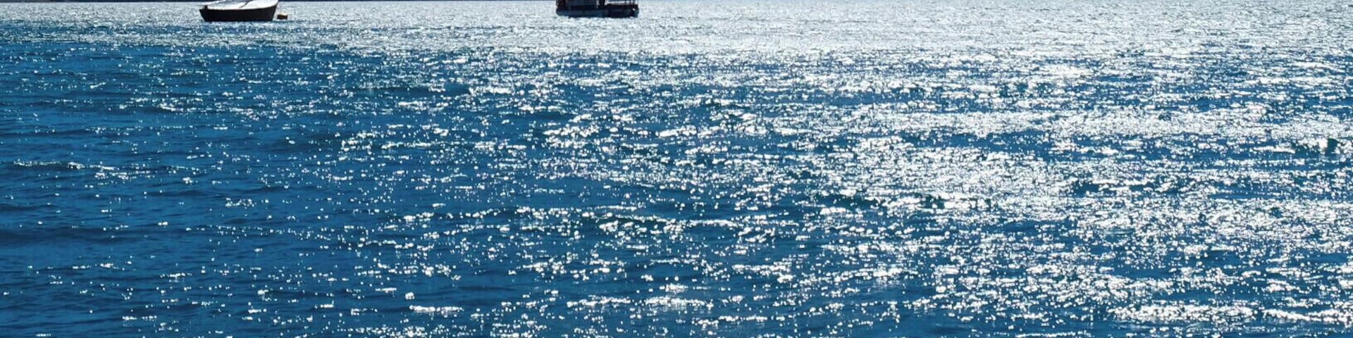 Sailing the "Todo los Santos" Lake with the the snow capped Osorno Volcano (2,652 metres) in the Back