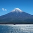 Sailing the "Todo los Santos" Lake with the the snow capped Osorno Volcano (2,652 metres) in the Back