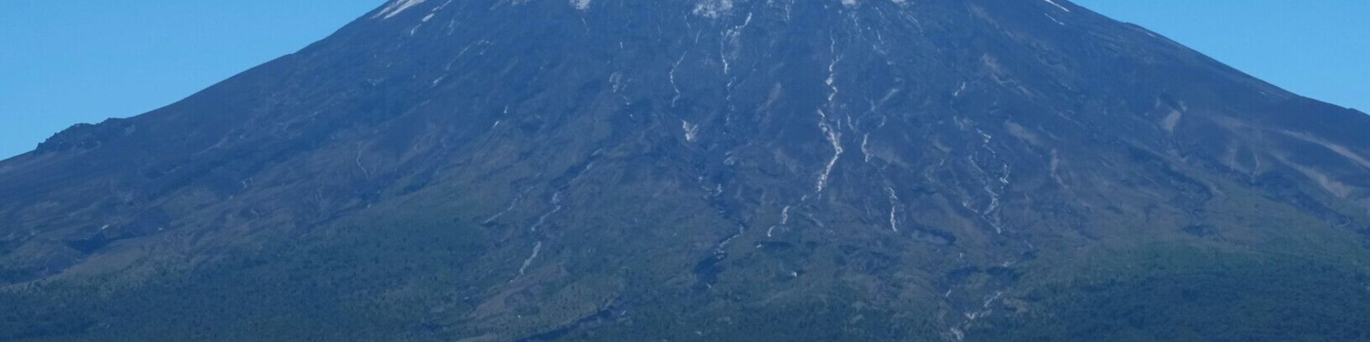 Sailing the "Todo los Santos" Lake with the the snow capped Osorno Volcano (2,652 metres) in the Back
