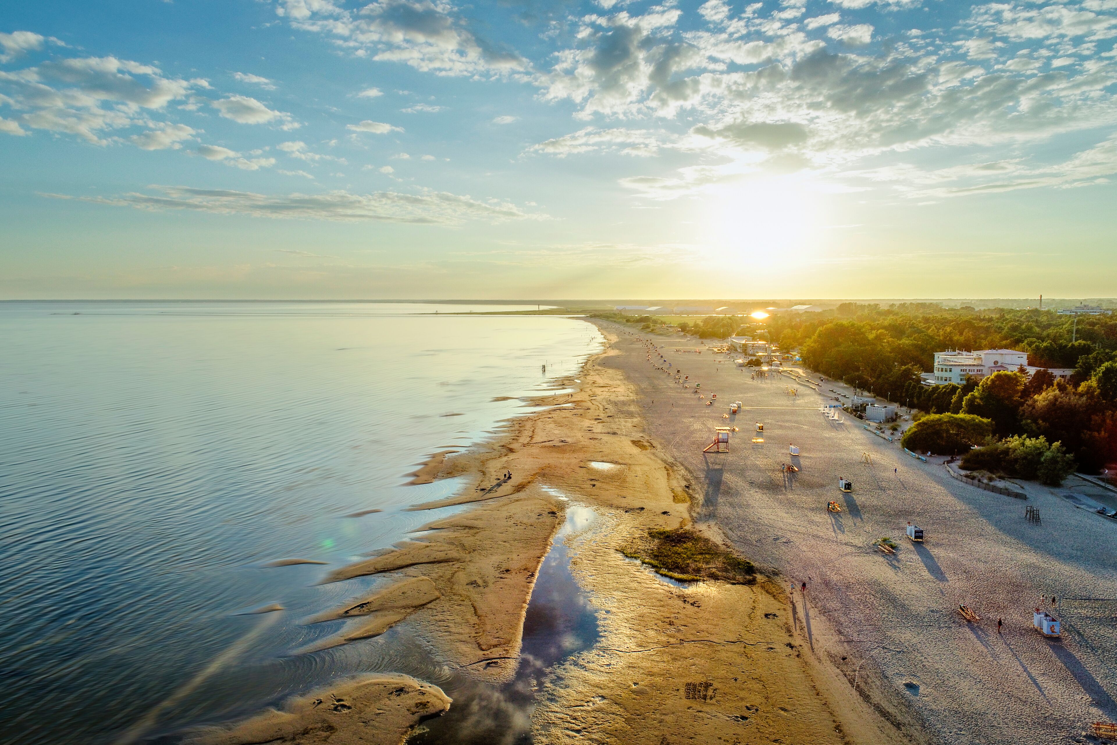 Parnu beach in Estonia during sunny summer sunset, aerial view