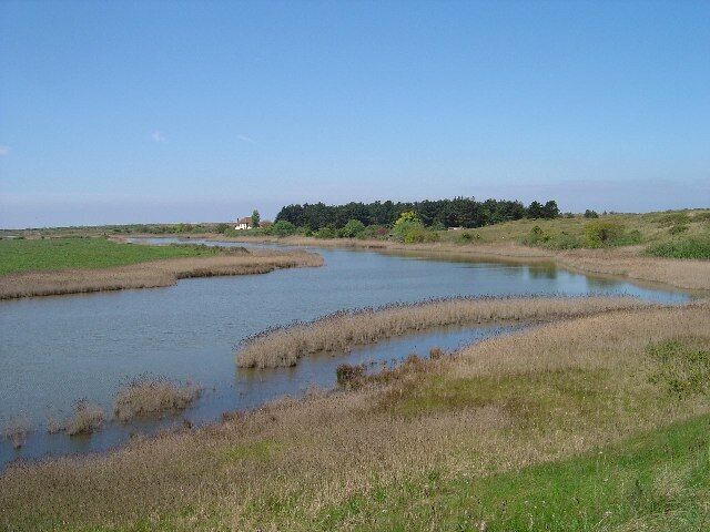 Broad Water. Looking SW across Broadwater a lagoon behind the dunes at Holme nature reserve. The building in the distance is the visitor centre for the reserve.
