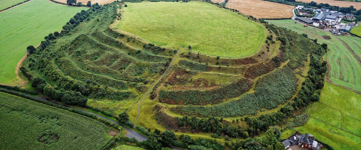 Old Oswestry early Iron Age hillfort, Shropshire, England. One of the best preserved in UK. Looking N.E. over the western entrance. Aerial late summer