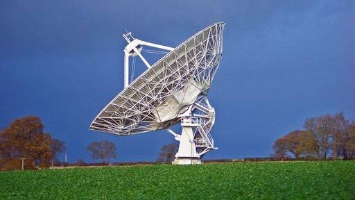 Knockin Radio Telescope Picture taken on a dark rainy day with a gap in the cloud for the sun to light up the telescope