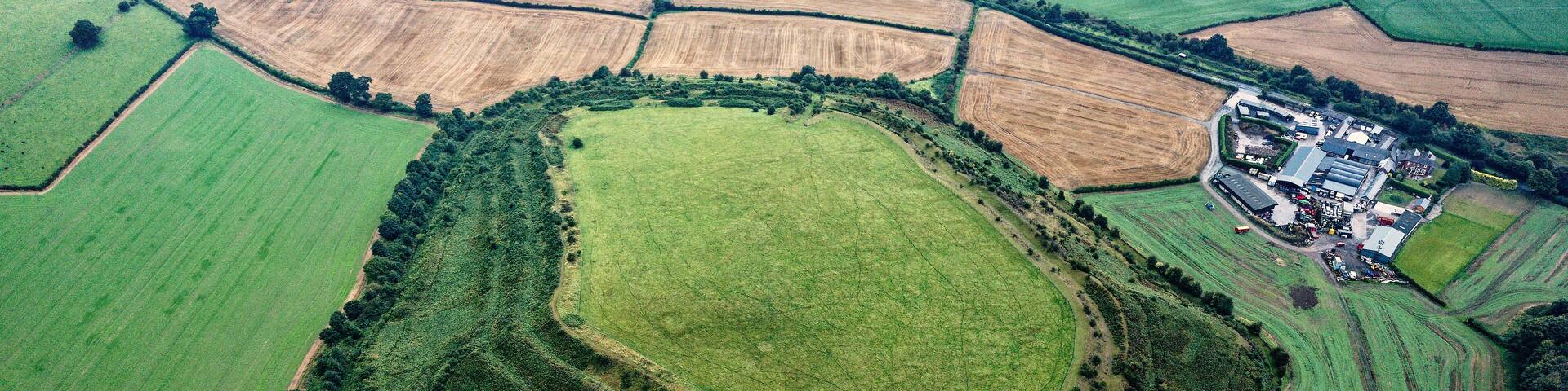 Old Oswestry early Iron Age hillfort, Shropshire, England. One of the best preserved in UK. Looking N.E. over the western entrance. Aerial late summer