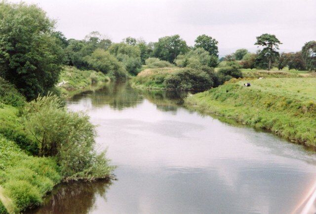 Confluence of rivers and joining of countries The River Severn on the left is joined by the Afon Vyrnwy on the right. The boundary between Wales (left) and England (right) is along the centre of the combined river before following the Vyrnwy.