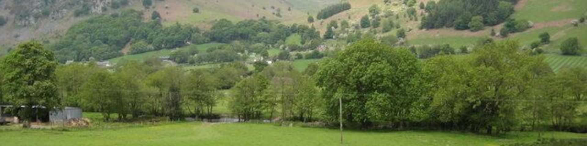 View across the Tanat Valley View across the Tanat Valley to a side valley between Criag Rhiwarth on the left and Y Garn on the right.