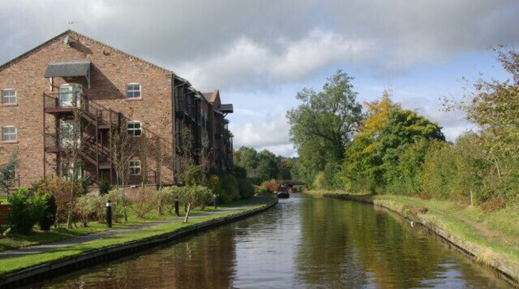 Lion Quays, Llangollen Canal. The building on the left of the canal is a modern hotel complex, with extensive visitor moorings, built to give the vague appearance of an old canal warehouse. This is approaching Moreton Bridge where the A5 crosses the canal.