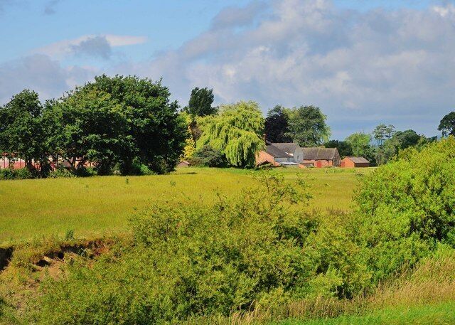 View of The Haim Farm Buildings Great use of trees to shield and enhance the scenery.
