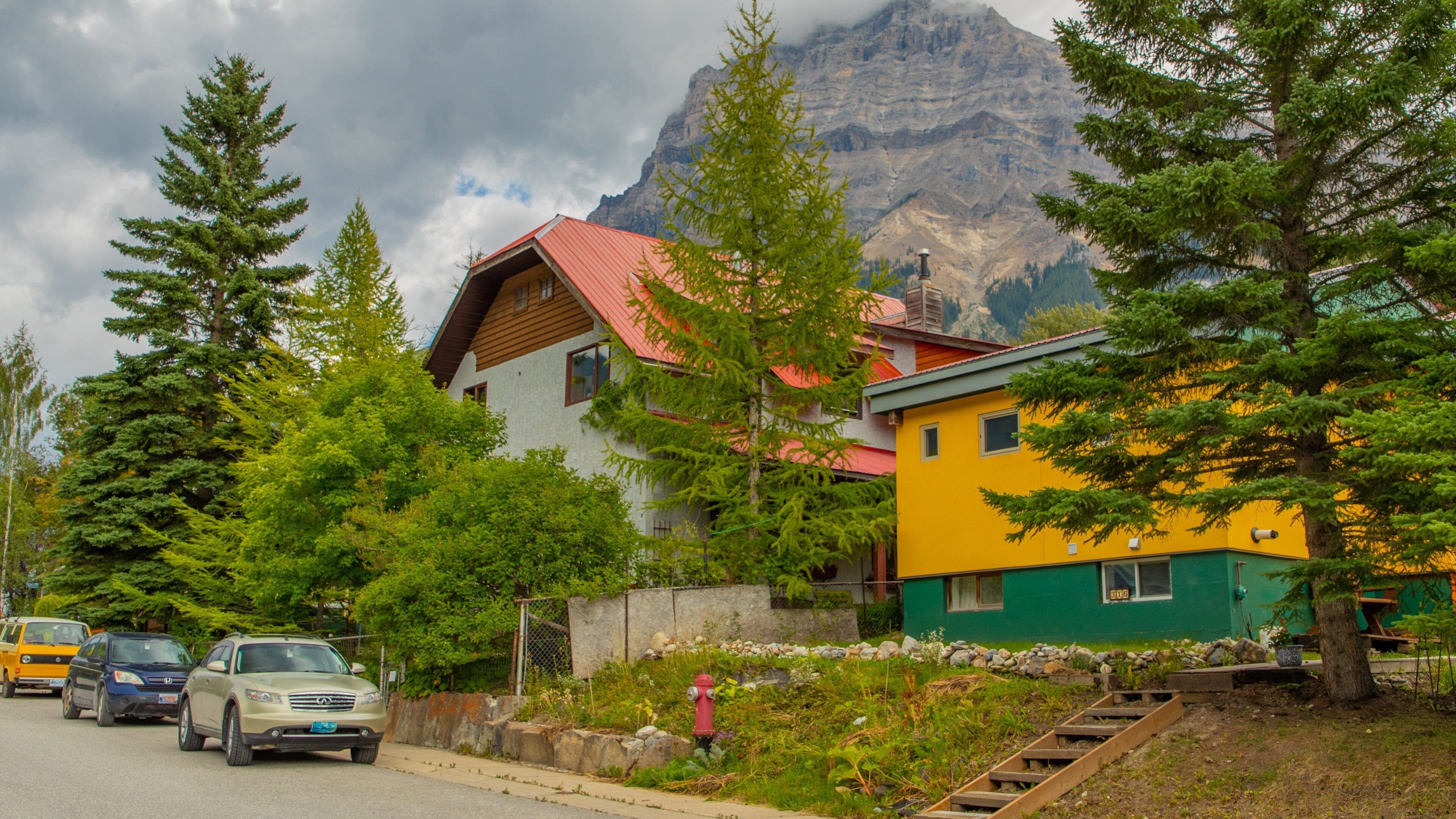 Field featuring a house and a small town or village