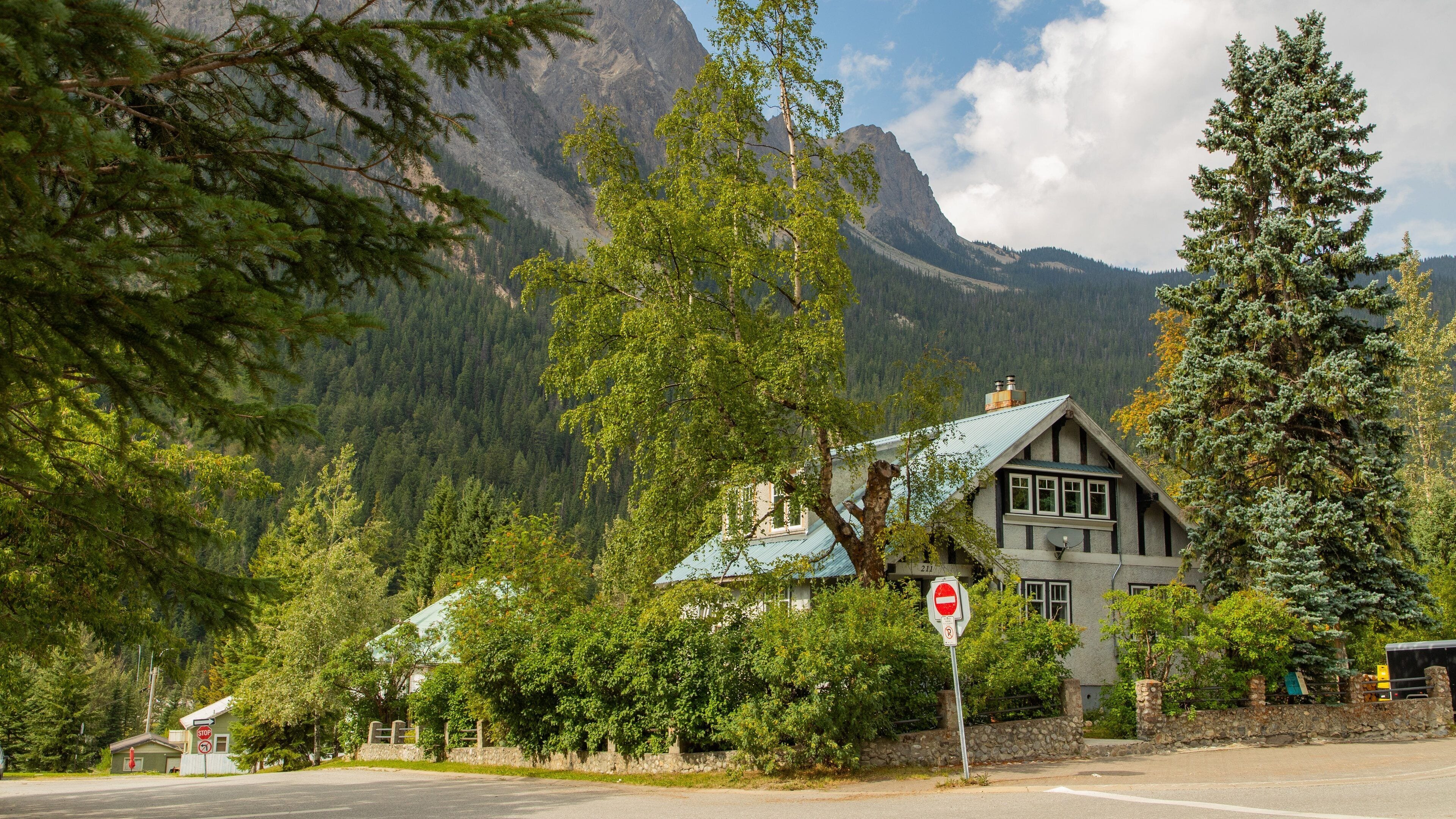 Field featuring a small town or village and a house