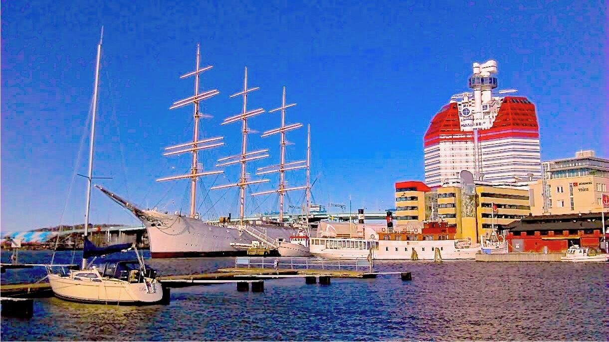 Gothenburg harbour, seen from the Guest Harbour at "Lilla Bommen".

The tall ship "Viking" is permanently anchored here, and serves as a hotel now.  The oddly looking house is called "The Lipstick" (Läppstiftet)  - guess why...! There is a lookout point at the top there, where you can get "a tremendous view over Gothenburg, the harbour, and the archipelago" Quote from arrivalguides.com - a sight I didn´t even know about until just now - but where there´s a lot of good information to be found in English, so do check it out!

In the background you can see parts of "Götaälvsbron", which is connecting the center of Gothenburg to the island "Hisingen" where the city continues.

The Opera is just to the left (but not in the photo), and just a bit further to the right side of this picture you find "Östra Nordstan". This is a large shopping mall where you can find  a Tourist Information Center, lots of parking, and free wifi (for one hour, according to  www.nordstan.se)

FOR MORE INFO:
www.nordstan.se
www.goteborg.se
www.arrivalguides.com
www.goteborgshamn.se