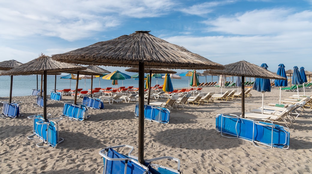 Umbrellas on Kardamena city beach in Kos island, Greece.