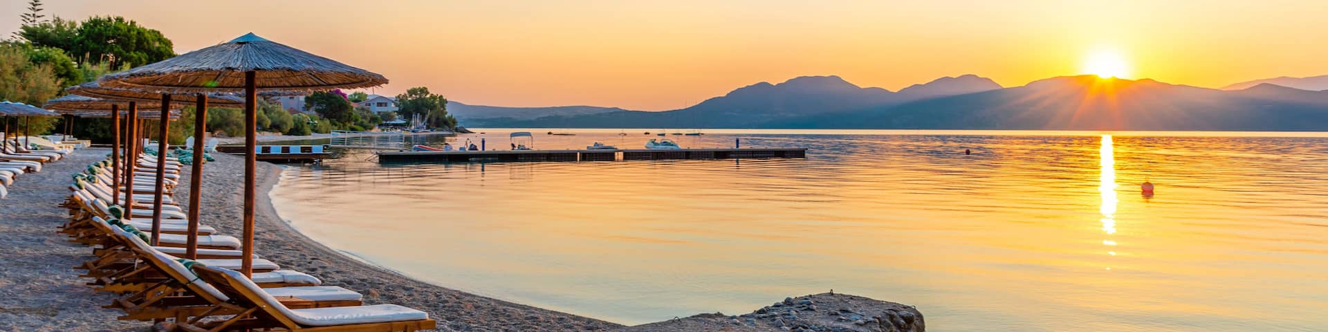 Seascape and vibrant sunset over Nikiana beach in Lefkada island