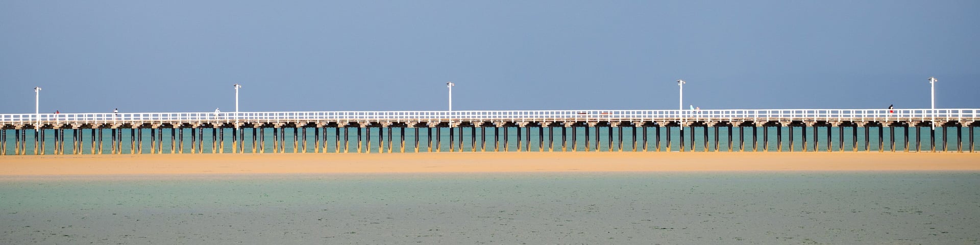 Urangan which includes a bridge and general coastal views