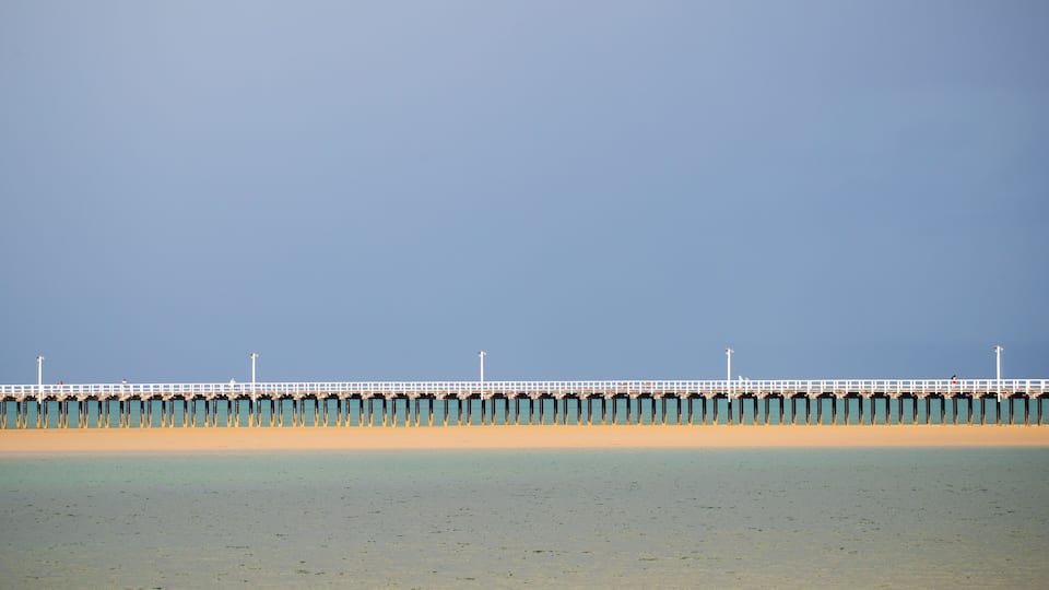 Urangan which includes a bridge and general coastal views