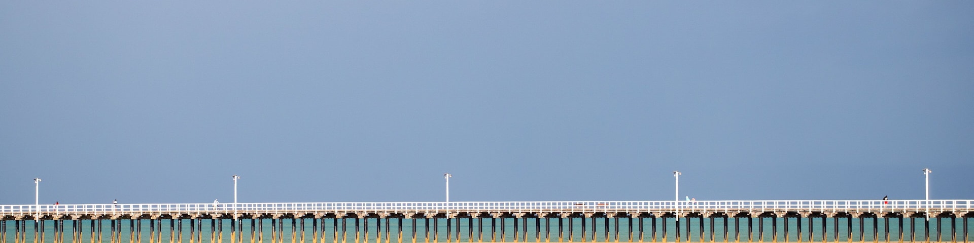 Urangan which includes a bridge and general coastal views