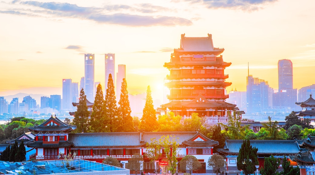 The combination of urban architecture and old architecture in Nanchang, China (the Chinese character in the ancient building is Tengwang Pavilion)