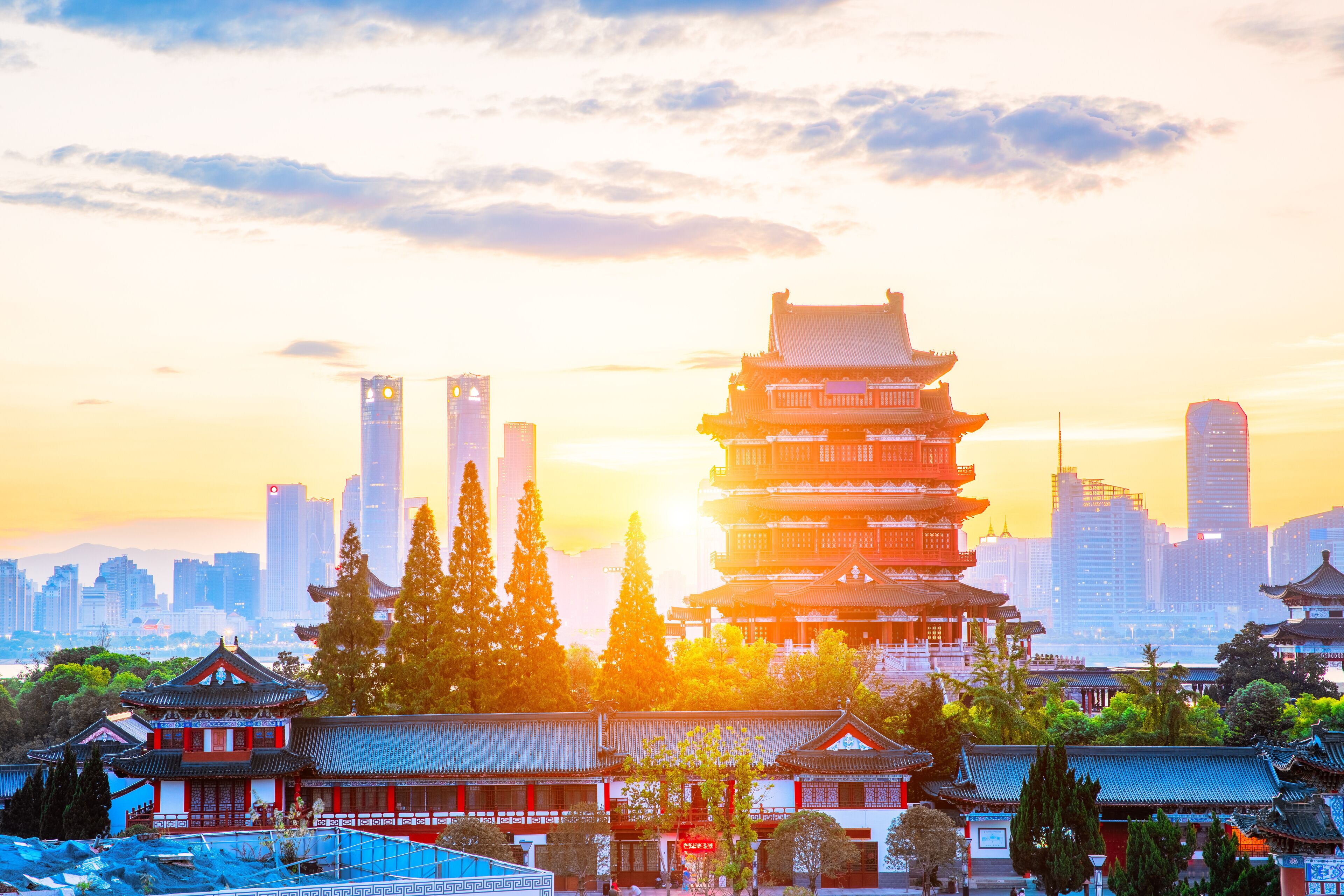 The combination of urban architecture and old architecture in Nanchang, China (the Chinese character in the ancient building is Tengwang Pavilion)