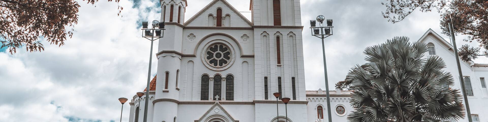 Church "igreja da Gloria" in Brazil, state Minas Gerais, in a small town Juiz de Fora town, with overcast sky in the background and a wide stairway in the foreground, wide-angle shot