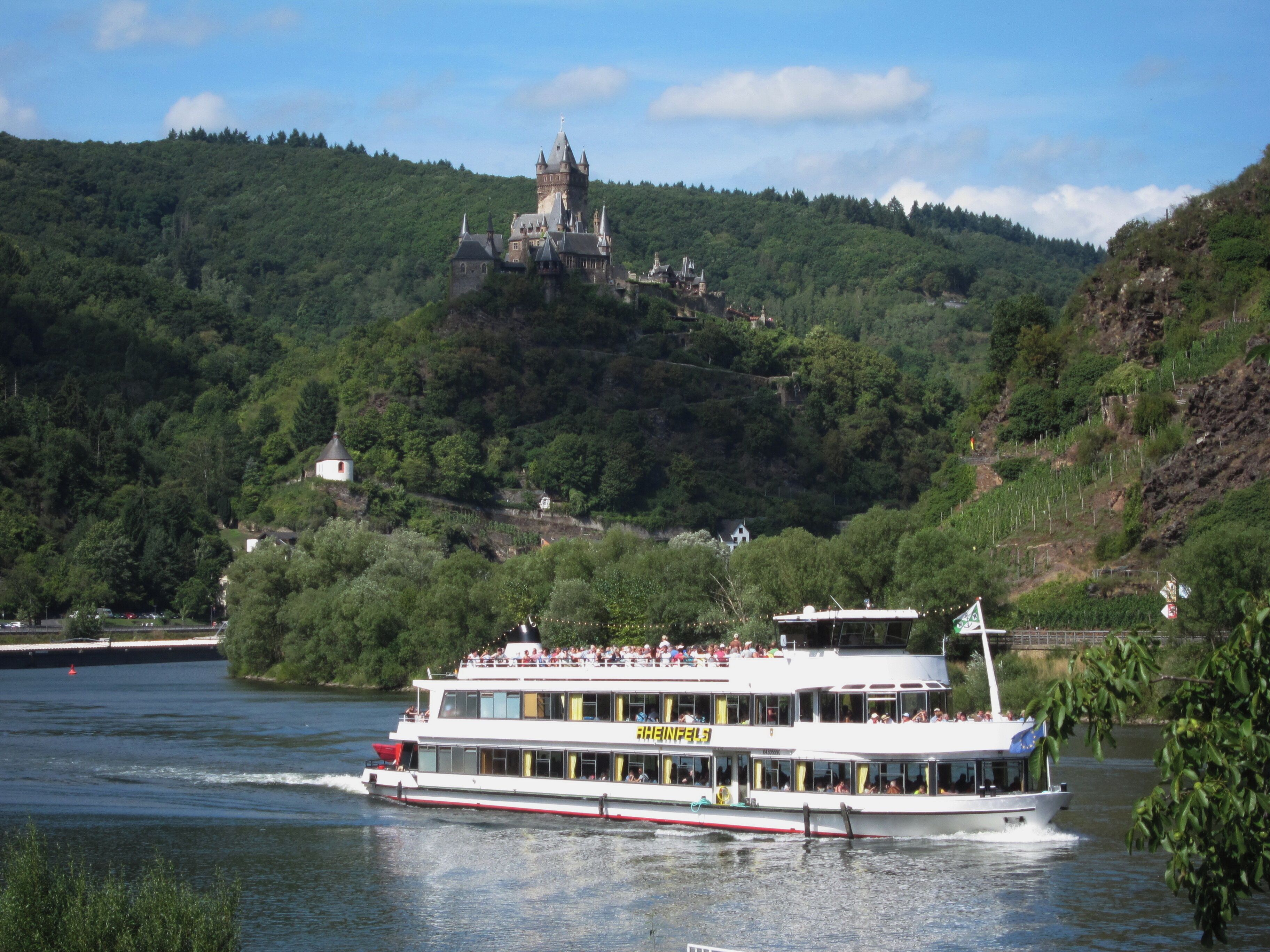 Panoramic view at Cochem along the Mosel river with its castle high rising over the city