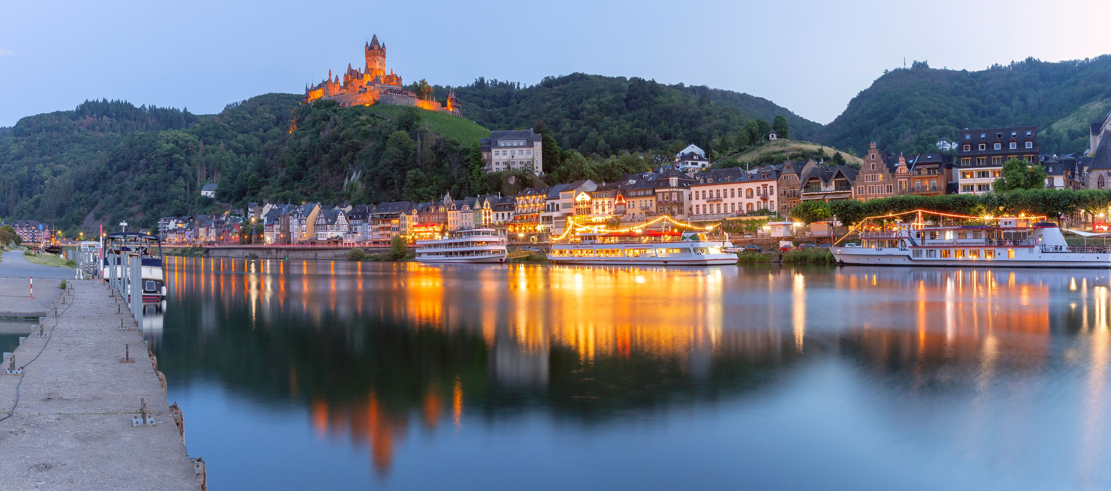 Cochem at sunset, beautiful town on romantic Moselle river, Reichsburg castle on hill, Germany