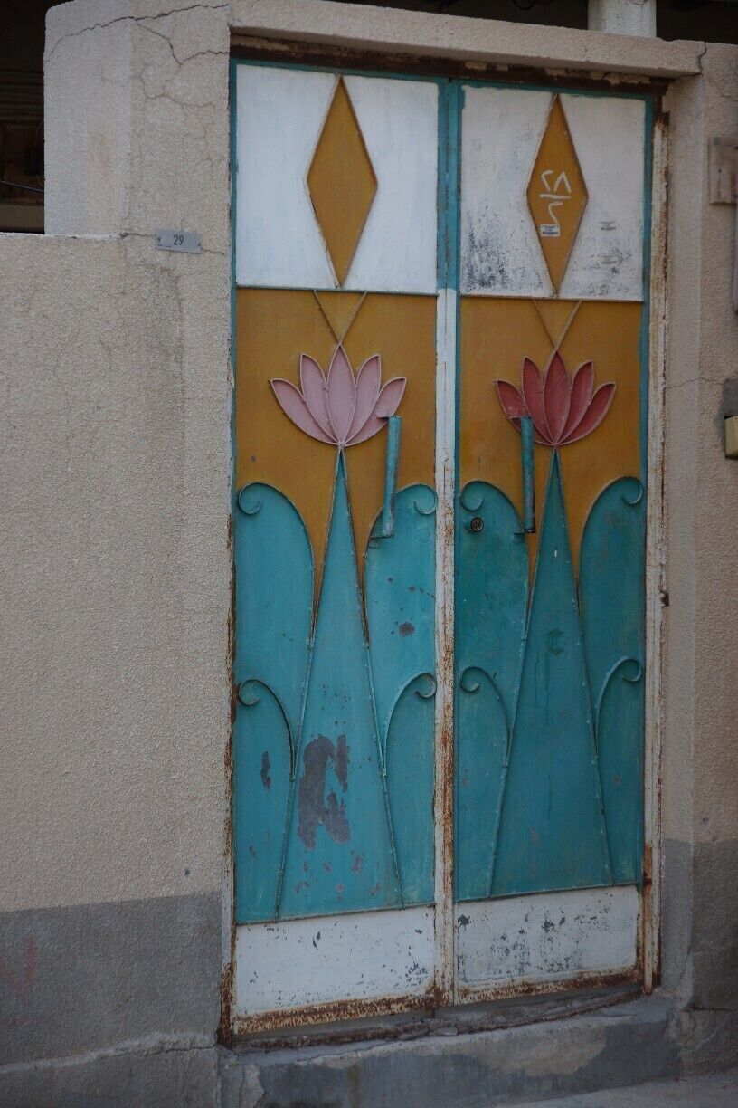 The drive along the coast from Khasab is cliff-hugging and stunning.  When you reach Qadah village - an old ruinous village that also has newer, inhabited houses among it, stop and have a look around.  All around here are the beautiful doors and gates that are unique to the Middle East.