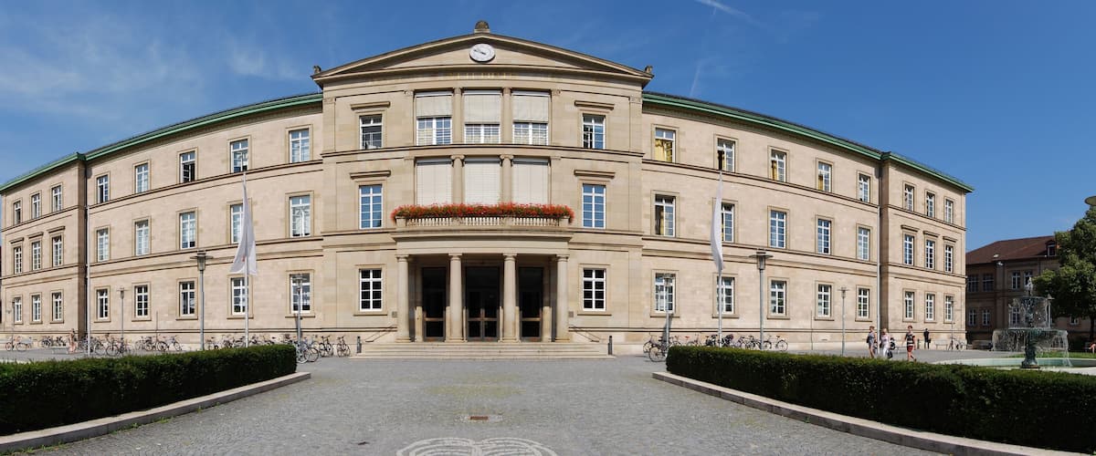 A large, classical building with a symmetrical facade, large windows, and a central entrance with columns.