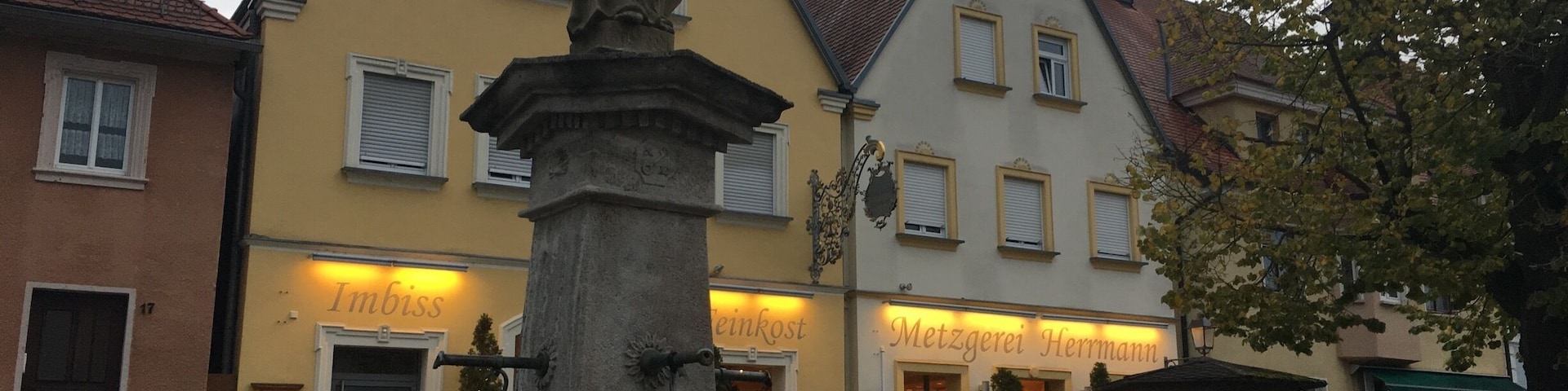 The small village of Schlüsselfeld. Saint Peter statue in market square.