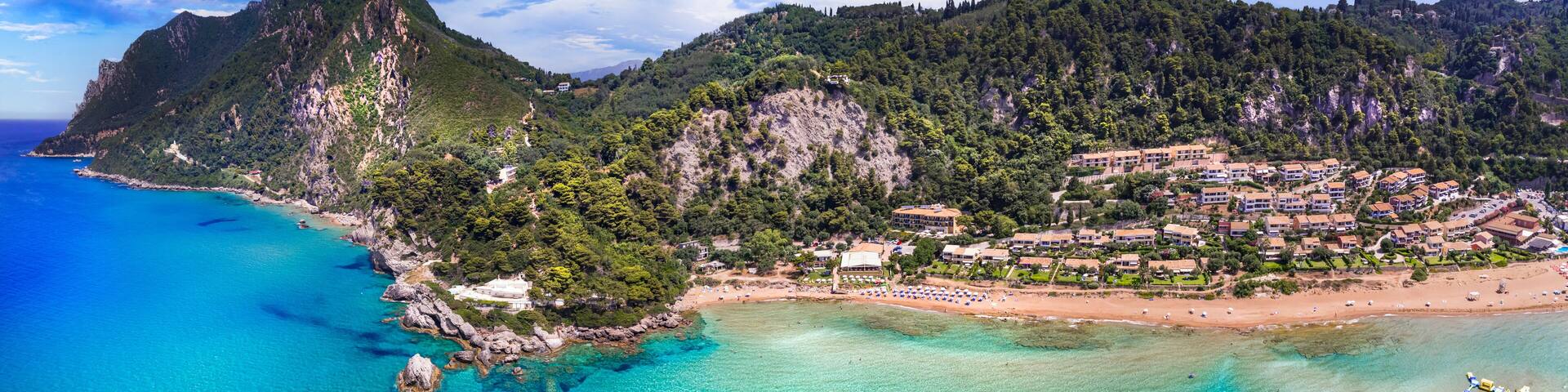 Greece summer holidays. Best scenic beaches of Corfu island - aerial panoramic view of Glyfada beach and village in western part