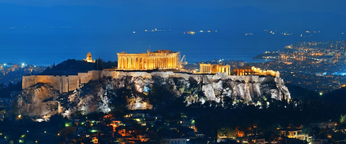 The Acropolis of Athens, including the Parthenon, on a rocky hill overlooking the city.
