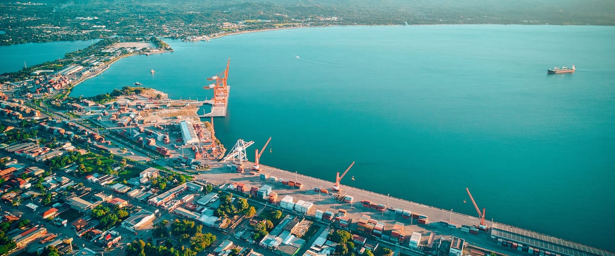 Aerial of seascape washing the shore of a harbor in Puerto Cortes, Honduras