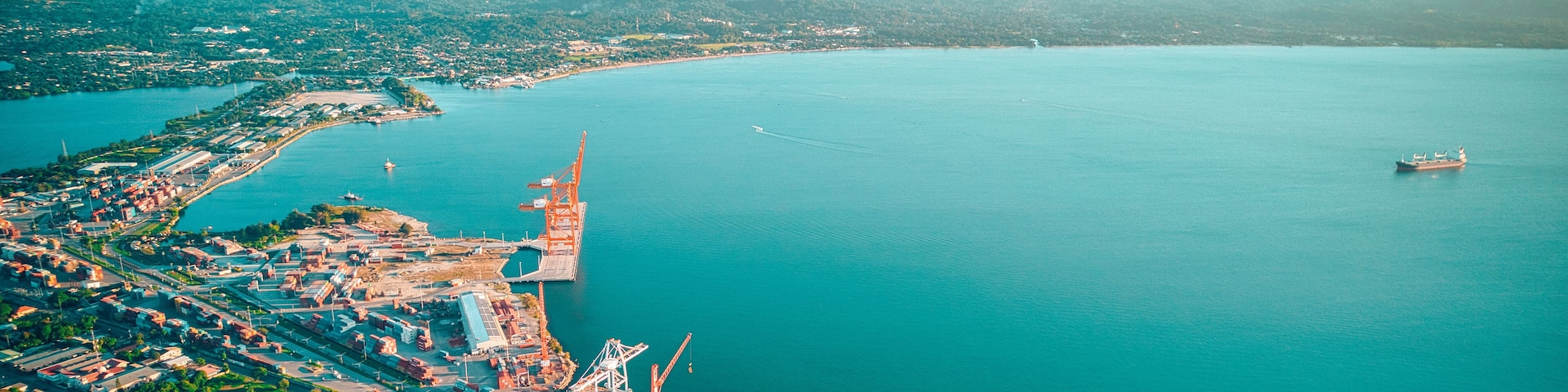 Aerial of seascape washing the shore of a harbor in Puerto Cortes, Honduras