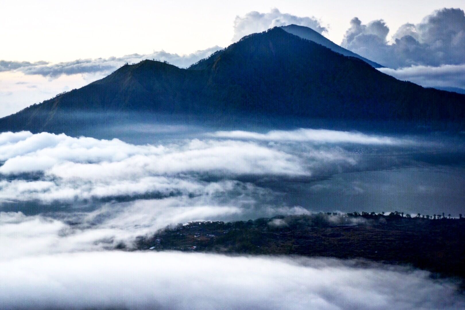 This middle of the night trek up a volcano to watch the sunrise above the clouds was well-worth the 1am wake up! A mildly challenging hike with spectacular views. #Blue #trekking #bali