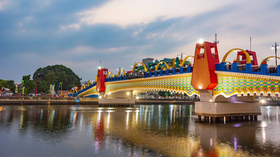 A photo of Brendeng Bridge (Jembatan Brendeng) across Cisadane River in Tangerang, Banten; at sunset.