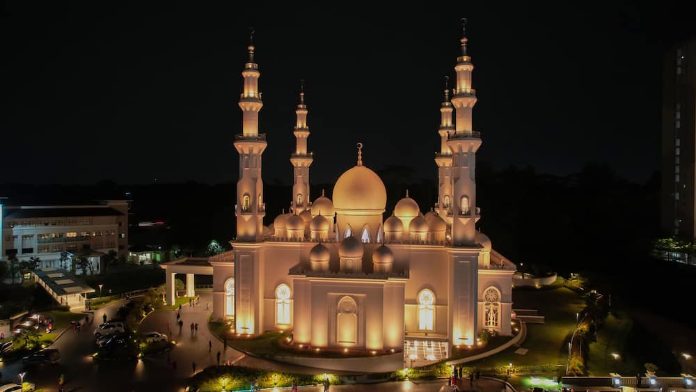 Aerial view of At-Thohir Mosque panorama at nihgt view Largest Mosque in Depok Place to visit in Indonesia. Depok, Indonesia, April 21, 2022